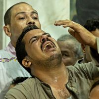 Egyptians mourn 41 killed in Cairo Coptic church fire