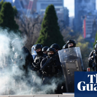 Melbourne police break up anti-lockdown protest with non-lethal rounds and teargas