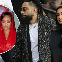 Amina Muaddi holds hands with comedian Fary Lopes on outing in Paris