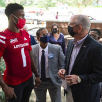 Acadiana, young people bearing brunt of latest COVID surge, Gov. John Bel Edwards notes on UL visit