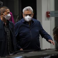 Former Sri Lanka president who fled homeland arrives in Thailand