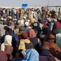 Hundreds of miles from Kabul, videos show a sea of people flooding Afghanistan’s border with Pakistan in a desperate bid to flee the country