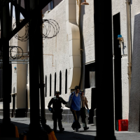 San Quentin guard, 2 others charged with smuggling cellphones to death row inmates