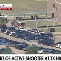 Texas high school shooting injures 4, suspect on the loose, Arlington police say