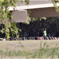 EXCLUSIVE: Haitian Migrant Encampment Under Border Bridge in Texas Swells to 2,000