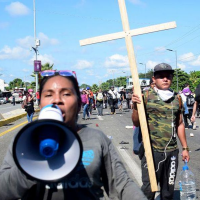 Migrant caravan that bulldozed Mexican National Guard was organized by QR code, sends message to Biden