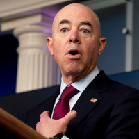 Protesters outside Mayorkas’ house unfold giant foil blanket tying Biden to Trump