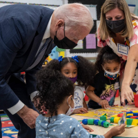 ‘He has a job to do’: Outspoken child steals the show at Biden school visit