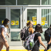 The Latest: Pediatricians favor school masks in Iowa case