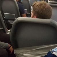 Frontier flight attendants placed on leave after taping unruly passenger to seat