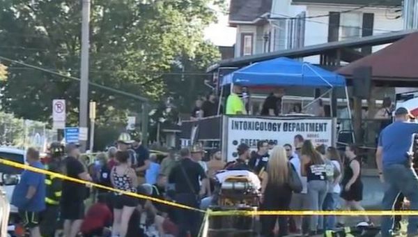 Two dead after car ploughs into crowd before driver attacks woman with hammer