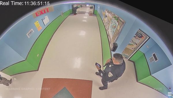 Officer seen on phone in Robb Elementary hallway was trying to contact wife who was killed, authorities say
