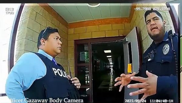 Footage shows how cops stood back as gunman continued to fire