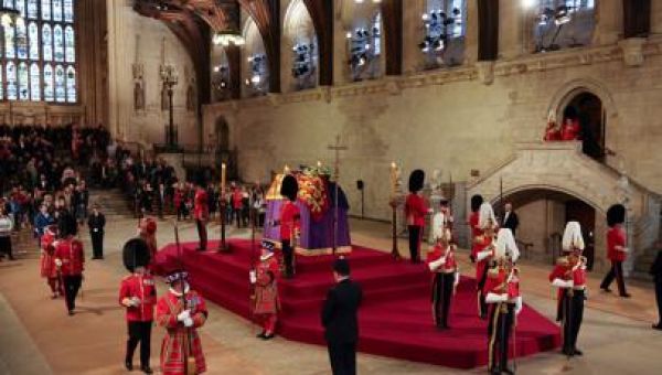 Live updates: Bidens pay their respects at queen’s coffin