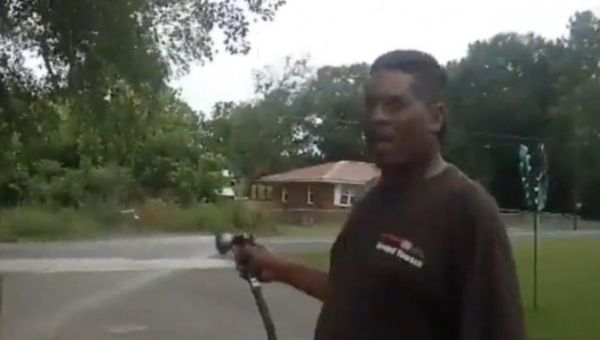 Black pastor sues police after being arrested while watering flowers