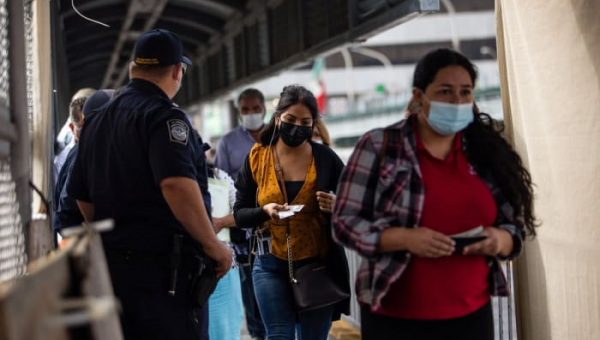 Judge blocks Biden administration from lifting public health order used to quickly expel migrants