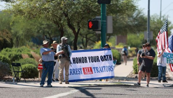 Armed Trump supporters protest outside FBI office in Phoenix