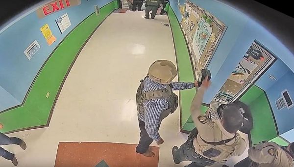 Security footage released from inside Uvalde, Texas, school confirms police ran away from gunfire, loitered in hallway