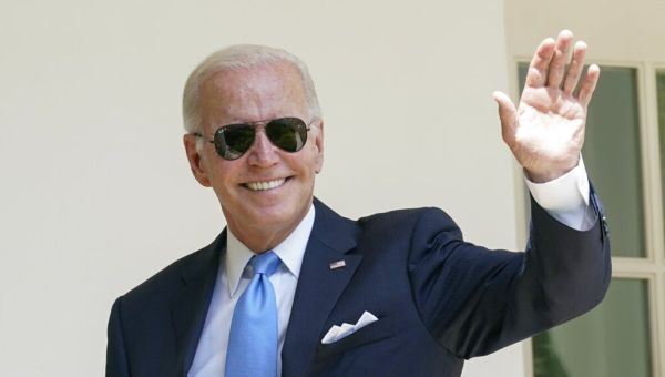 Biden takes COVID-19 victory lap, and shot at Trump, after negative test
