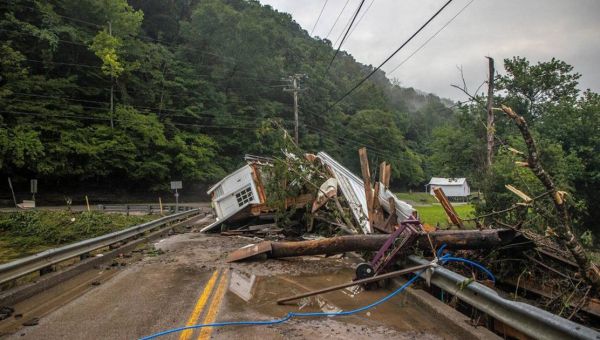 Some Appalachia residents begin cleanup after deadly floods