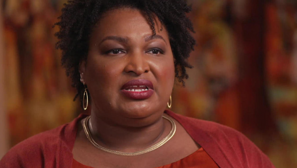 Stacey Abrams criticized after posing maskless surrounded by masked children