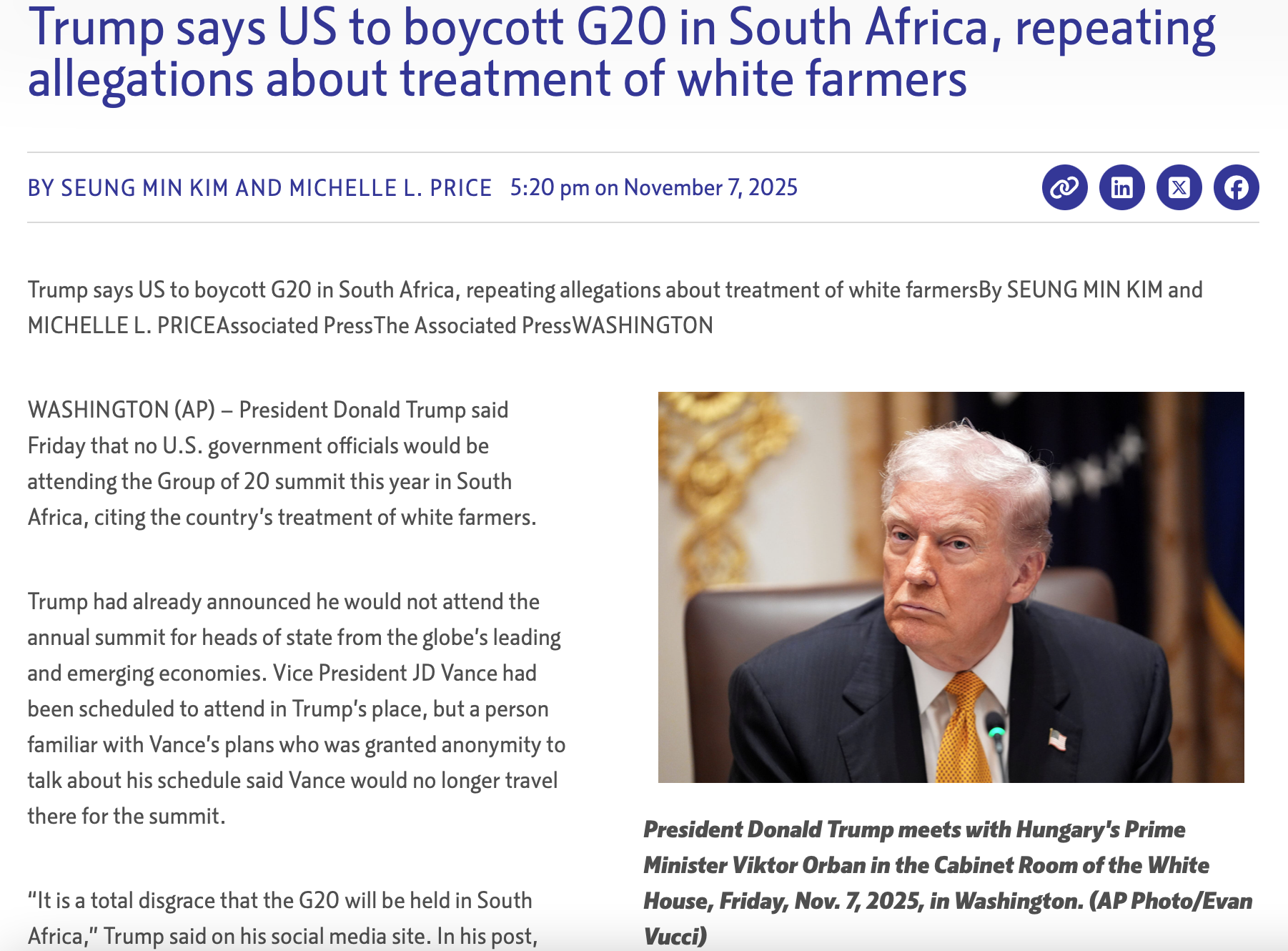 President Donald Trump sits at a table with papers near Hungary's Prime Minister Viktor Orban in the White House, Washington, November 7, 2025.