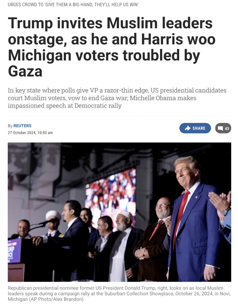 Donald Trump stands onstage with several Muslim leaders at a campaign rally in Novi, Michigan, as an audience looks on.