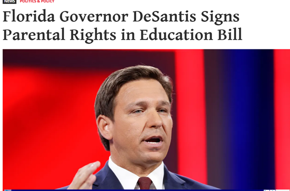 Florida Governor Ron DeSantis speaks at an event with a headline about him signing the Parental Rights in Education Bill.